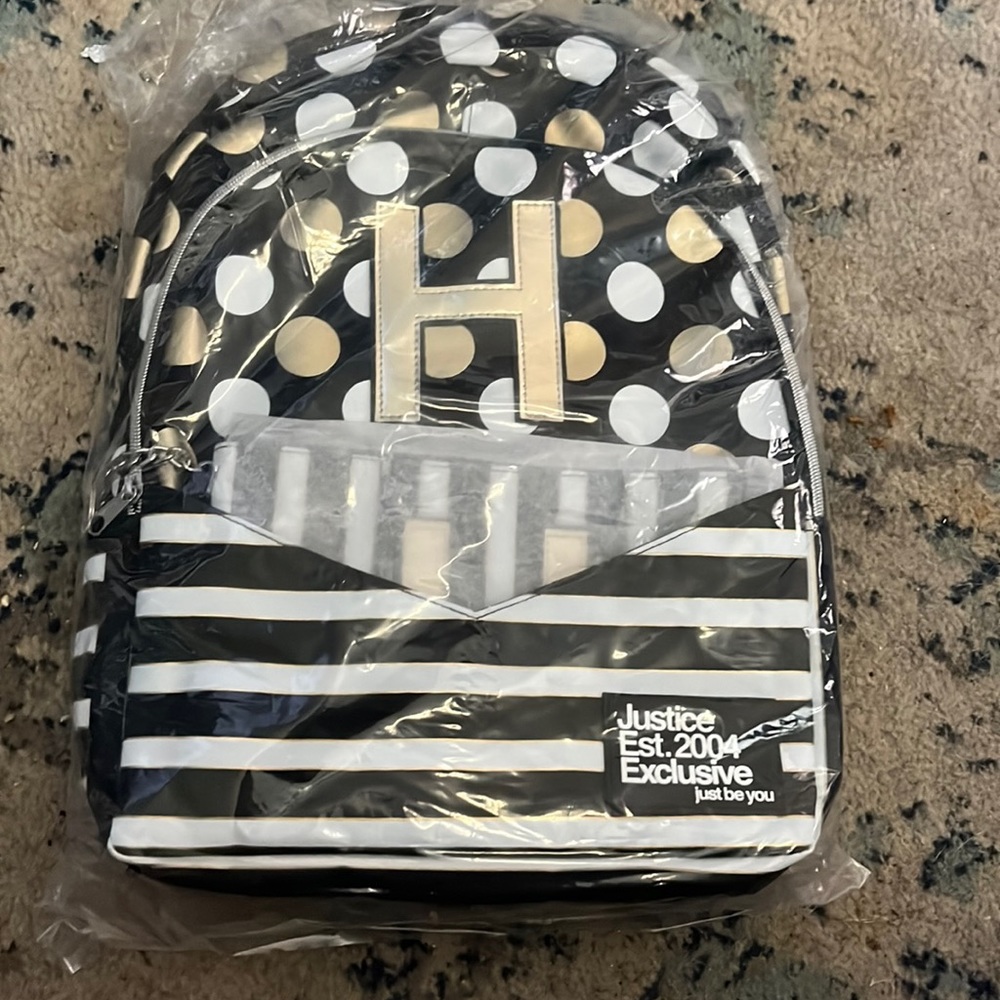 Justice initial H backpack with detachable wristlet.